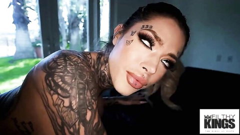 Huge titted inked blonde babe with oil dripping on her tattooed body