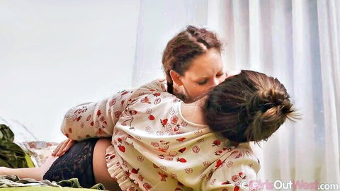Ria and Trixie in passionate interracial lesbian neck kiss embrace
