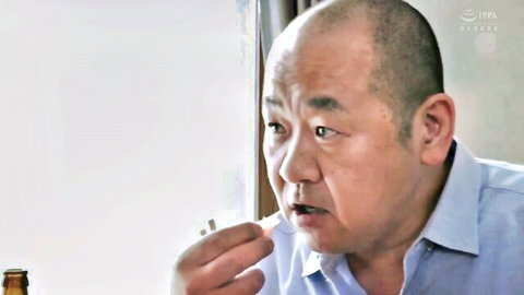 Bald Japanese man smoking in mature JAV bedroom scene