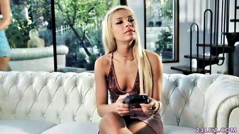 Natalia Starr in sexy burgundy dress gaming on couch with Alia Star