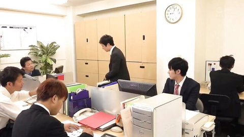 Japanese office workers in suits collaborating at desks, JAV thumbnail