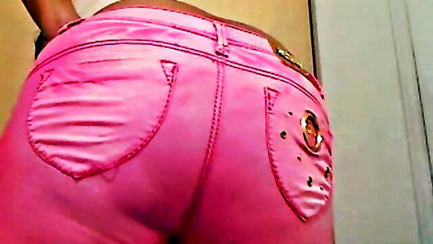 Ebony cutie flaunting her big ass in tight pink jeans