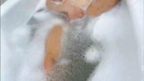 Amateur MILF in bubbly bath giving homemade blowjob