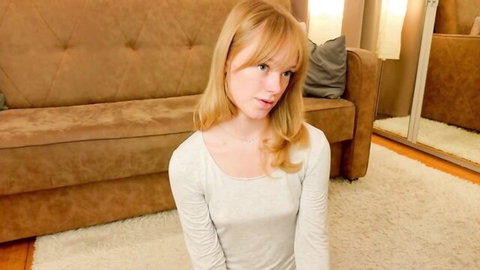 Jewell Hogan young redhead Chaturbate girl kneeling in gray top