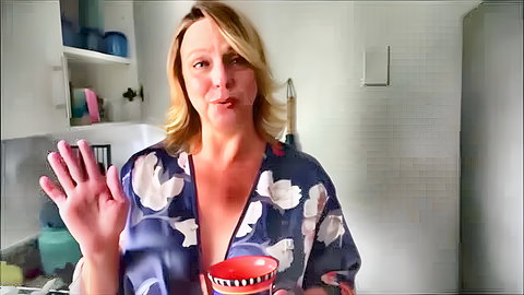 Blonde hot mom in open floral robe waving, showing cleavage