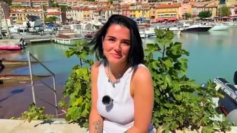 Rose 20yo French vet student smiling in white tank top by marina