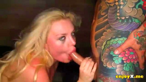 Miss Jackson blonde with huge tits gives blowjob to tattooed cock