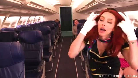 Ariel Demure redhead trans stewardess in sexy uniform teases on plane
