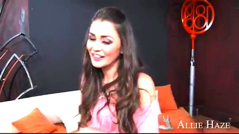 Allie Haze smiling seductively in pink off-shoulder top