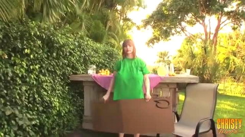 Busty Christy Mack holds gloryhole box at lemonade stand