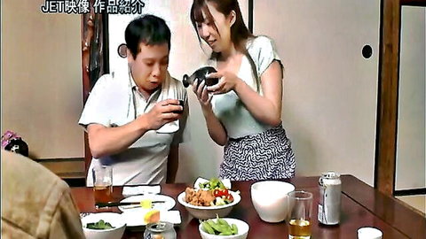 Busty Asian housewife pouring sauce at dinner table, big boobs in casual top