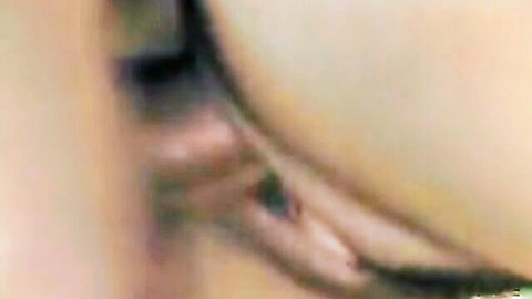 Close-up of seductive woman's green eye with long lashes and soft skin