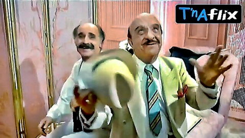Paola Liguori breasts scene in Intervista with suited men