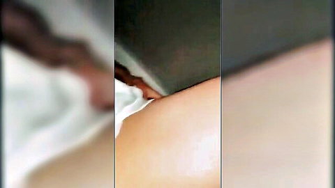 Blurry closeup of curvy woman in white dress-up outfit, mom-son tease