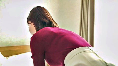 Eimi Fukada in red sweater and upskirt on bed, teasing back view