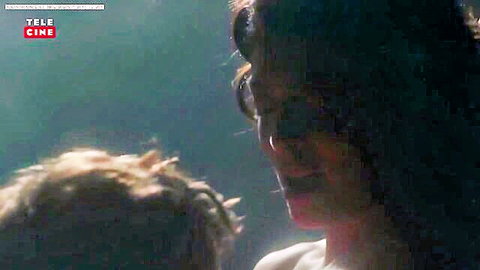 Juliana Paes as Dona Flor in tender moment with child, Brazilian film scene