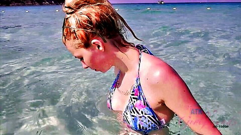 Kenzie Reeves in revealing zebra bikini in shallow beach water, POV tease