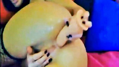 Busty camgirl double penetrates anally with large dildos in webcam show