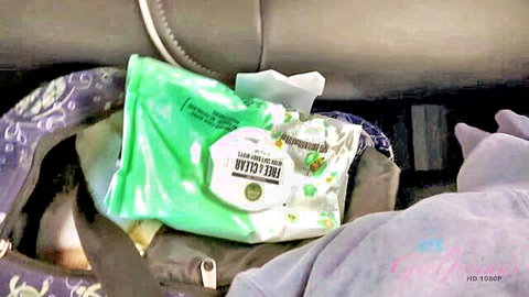 Mi Ha Doan in car vacation ride setup with wipes and bags