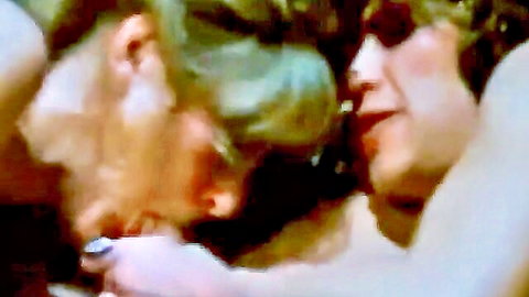 Hairy vintage guy roughly grabs blonde babe's face for intense close-up kiss in retro porn