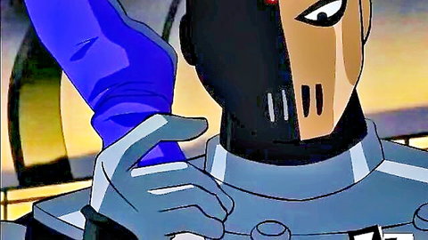 Blue-gloved hand grips masked villain Slade's collar tightly in intense cartoon scene