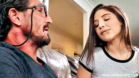 Brunette teen in tight shirt gazes seductively at DILF stepdad on couch in taboo scene
