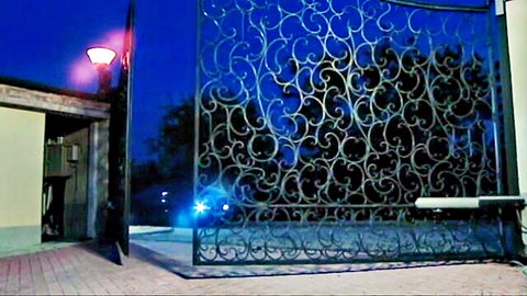 Mandy Bright and Jessica Moore approach mysterious night gate in Deepa & Deeper