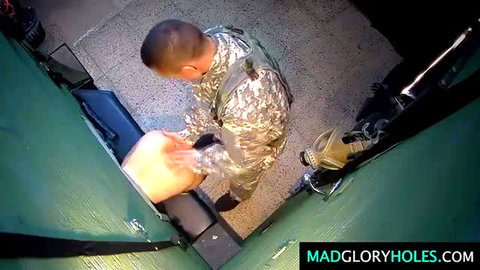 Camo soldier gropes pale thigh at gloryhole booth