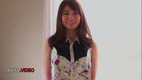 Seductive Japanese JAV star in daisy floral top smiles sultrily