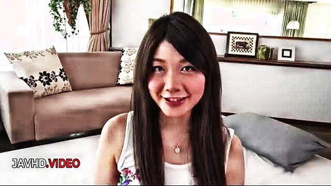 Busty Rie Tachikawa smiling in white tank top JAV thumbnail