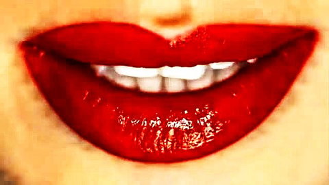 Lexi Luna's seductive glossy red lips smiling