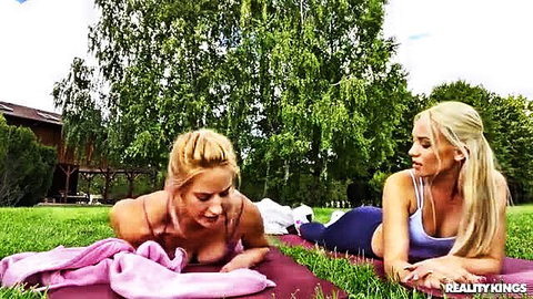 Blonde yoga babes Barbie Brill & Amy Douxxx stretching outdoors on mats