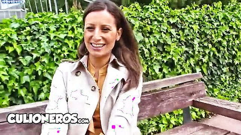 Sensual Jane smiling in white sexy jacket outdoors on bench