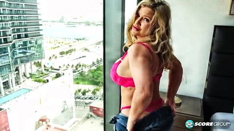 Blonde MILF Andie Anderson in pink lingerie, big tits ass view
