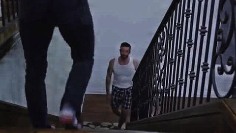 Muscular man in tank top and shorts on stairs in Gia Derza stepbro scene