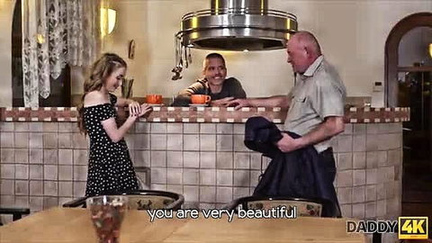 Blonde teen in dress chats with boyfriend's dad at kitchen counter Daddy4K