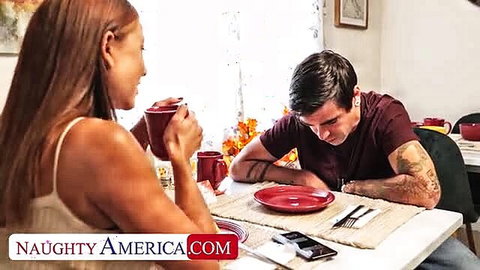 Cassie Del Isla shares coffee with tattooed guy at table in Naughty America