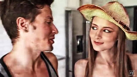 Kyler Quinn in cowboy hat smiles at Jay Romero in Summer Of Love