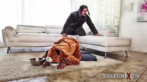 Abby Lee Brazil in dog costume eats from bowl in petplay scene