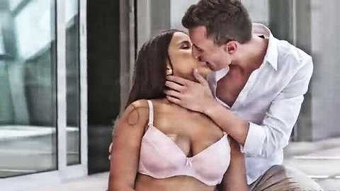 Curvy Indian brunette in pink bra passionately kissed by white guy outdoors