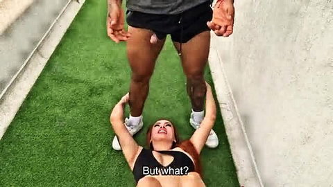 Hot Latina on back under buff black guy with visible cock in shorts outdoors
