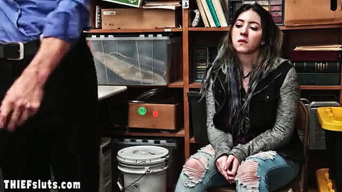 Asian teen girl in ripped jeans sits nervously with older man in room