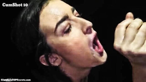 Brunette beauty facial cumshot, mouth open taking load closeup