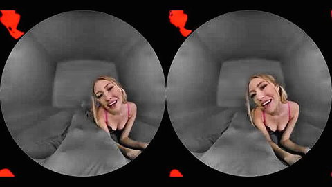 Blonde in pink lingerie smiles playfully on bed in VR POV