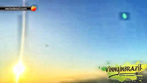 Stunning Brazilian woman in lingerie poses with UFO beam at sunset