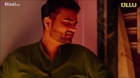 Handsome bearded Indian MILF man smiling seductively in green kurta