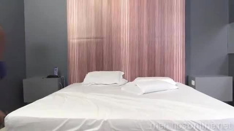 Sleazy Bottom on bed in lingerie, teasing pose