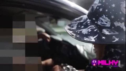 Yorgelis Carrillo in car with starry witch hat, sexy tease