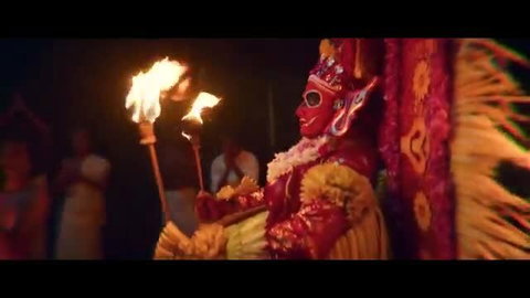 Shruthy Menon in fiery red Vadakkan ritual costume with torches