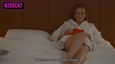Blonde stepmom in robe on bed says 'I'm more of a Slytherin' laughs